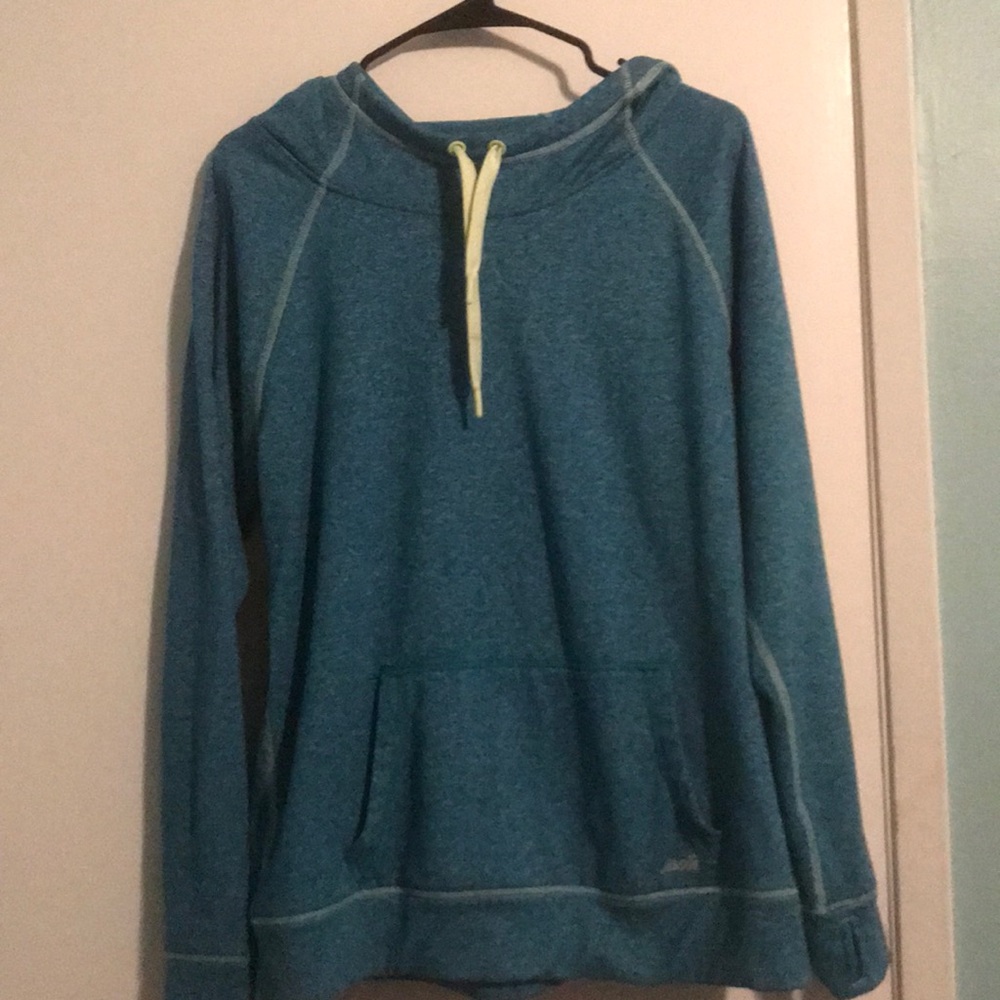 Blue workout sweater with green accents
